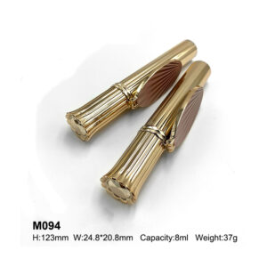 round golden mascara bottle with a mirror