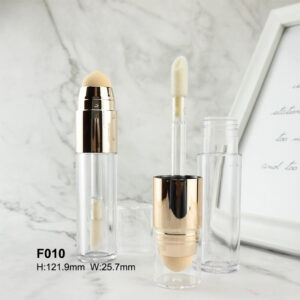 transparent golden foundation bottle with brush and sponge