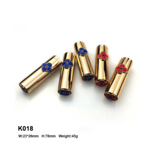 golden lipstick tube with flower ring