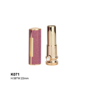 round golden lipstick tube with leather