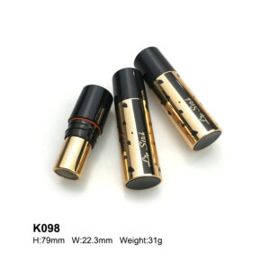 round golden black lipstick tube with print