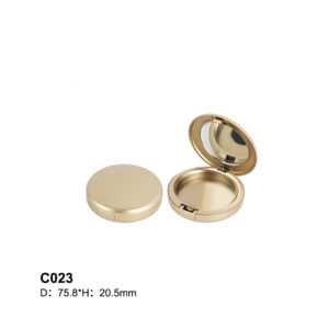 round golden powder compact case